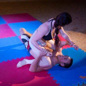 Xena attempts to pin Martin's shoulders down with her knees