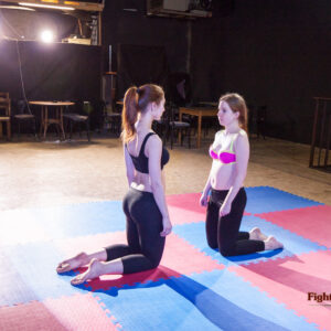 Pre-match staredown between Akela and Revana